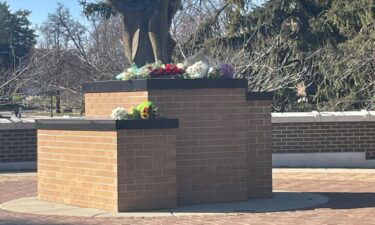 The Community rallies around each other day after a deadly mass shooting on Michigan State University’s campus. Flowers are pictured at the foot of the Spartan statue to remember the three students that were killed