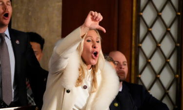 Rep. Marjorie Taylor Greene yells in the chambers as President Joe Biden speaks during the State of the Union address in Washington.