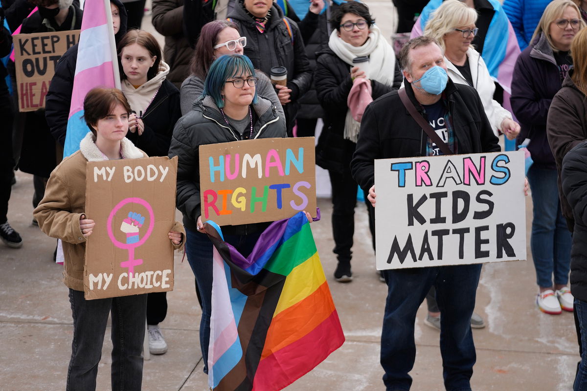 <i>Rick Bowmer/AP</i><br/>People gather in support of transgender youth during a rally at the Utah State Capitol in January