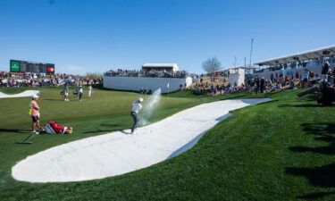 McIlroy plays out of a bunker during the final round.