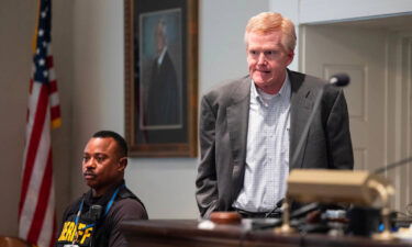 Alex Murdaugh stands during a break in his murder trial on Friday.