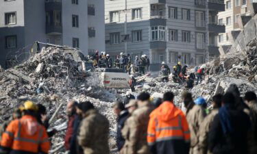 Personnel conduct search and rescue operations in the debris of the building where Atsu lives in Hatay