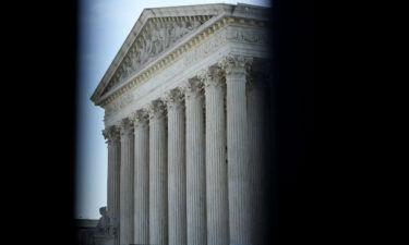 The US Supreme Court is seen here through security fencing in May 2022 in Washington