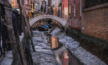 A nearly completely dry canal in Venice in early February.