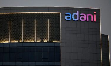 Shares in most Adani Group companies slumped again on Friday. The logo of the Adani Group is seen on one of its buildings in Ahmedabad