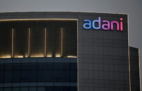 Shares in most Adani Group companies slumped again on Friday. The logo of the Adani Group is seen on one of its buildings in Ahmedabad