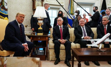 U.S. President Donald Trump (L) talks to reporters while hosting Iraqi Prime Minister Mustafa Al-Kadhimi and (L-R) Vice President Mike Pence