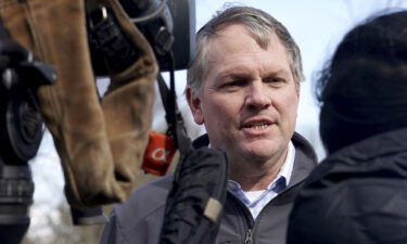 Norfolk Southern President and CEO Alan Shaw speaks to reporters on February 21 near the site where a freight train derailed on February 3 in East Palestine