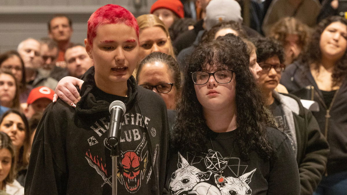 <i>Peter Ackerman/Asbury Park Press/USA Today Network</i><br/>A student at Central Regional High School in Berkeley Township is comforted during a school board meeting as she speaks about the abuse she says she has received.