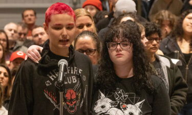 A student at Central Regional High School in Berkeley Township is comforted during a school board meeting as she speaks about the abuse she says she has received.