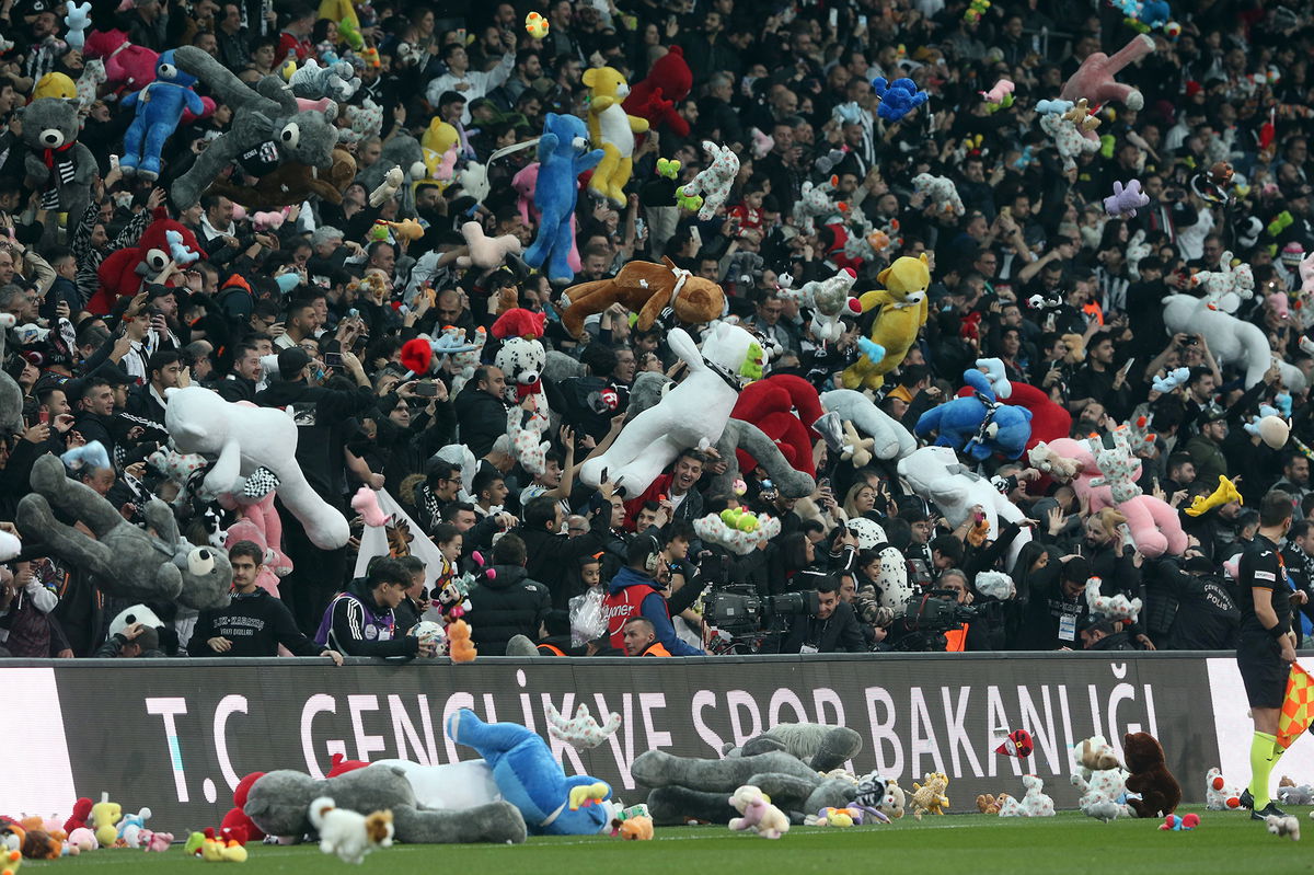 <i>Huseyin Yavuz/dia images/Getty Images</i><br/>Toys are passed onto the pitch for children affected by the earthquake in Turkey and Syria.