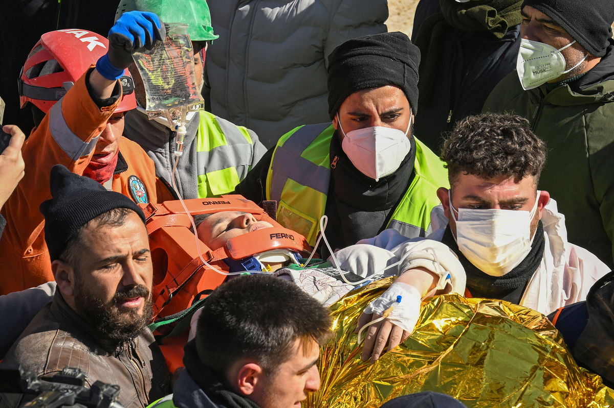 KAHRAMANMARAS, TURKIYE - FEBRUARY 16: 17 year-old girl Aleyna Olmez rescued from the rubbles of collapsed Atabey Apartment in Kayabasi neighbourgood 248 hours after 7.7 and 7.6 magnitude earthquakes hit Turkiye's provinces, on February 15, 2023 in Kahramanmaras, Turkiye. Search and rescue personnel give consolation to relatives of quake victims. On Feb. 06, a strong 7.7 earthquake, centered in the Pazarcik district, jolted Kahramanmaras and strongly shook several provinces, including Gaziantep, Sanliurfa, Diyarbakir, Adana, Adiyaman, Malatya, Osmaniye, Hatay, and Kilis. Later, at 13.24 p.m. (1024GMT), a 7.6 magnitude quake centered in Kahramanmaras' Elbistan district struck the region. (Photo by Mehmet Kaman/Anadolu Agency via Getty Images)