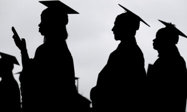 President Joe Biden's student loan forgiveness plan goes before the Supreme Court Tuesday. New graduates line up before the start of a community college commencement in East Rutherford