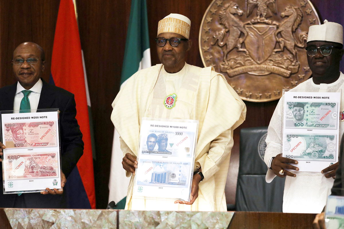 <i>Afolabi Sotunde/Reuters</i><br/>Nigeria reissues the old 200-naira ($0.43) banknotes as cash fiasco threatens to disrupt the general elections later this month. Nigerian President Muhammadu Buhari (C) is pictured here during the launch of the new currency in Abuja