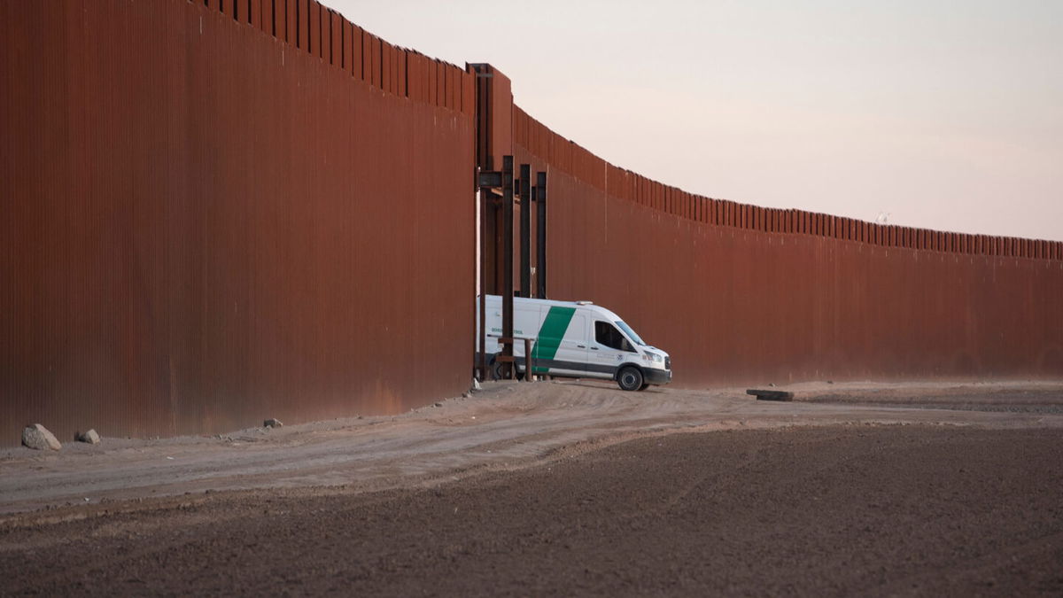 <i>Rebecca Noble/AFP/Getty Images</i><br/>A Border Patrol van reverses through a gate in the US-Mexico border fence in San Luis