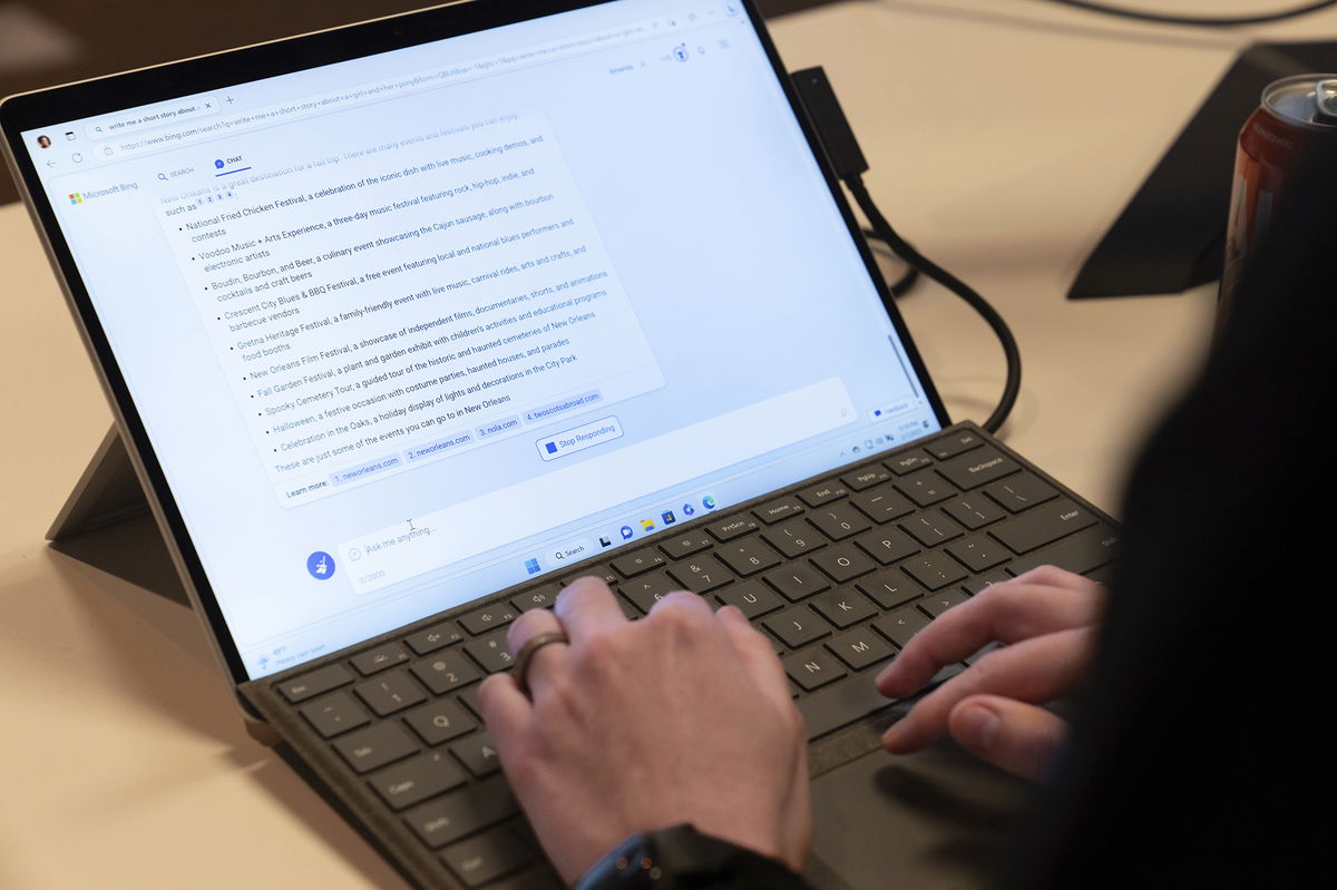 <i>Stephen Brashear/AP</i><br/>Microsoft employee Alex Buscher demonstrates a search feature integration of Microsoft Bing search engine and Edge browser with OpenAI on Tuesday in Redmond.