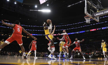 Dennis Schröder of the Los Angeles Lakers shoots over Jonas Valančiūnas of the New Orleans Pelicans.