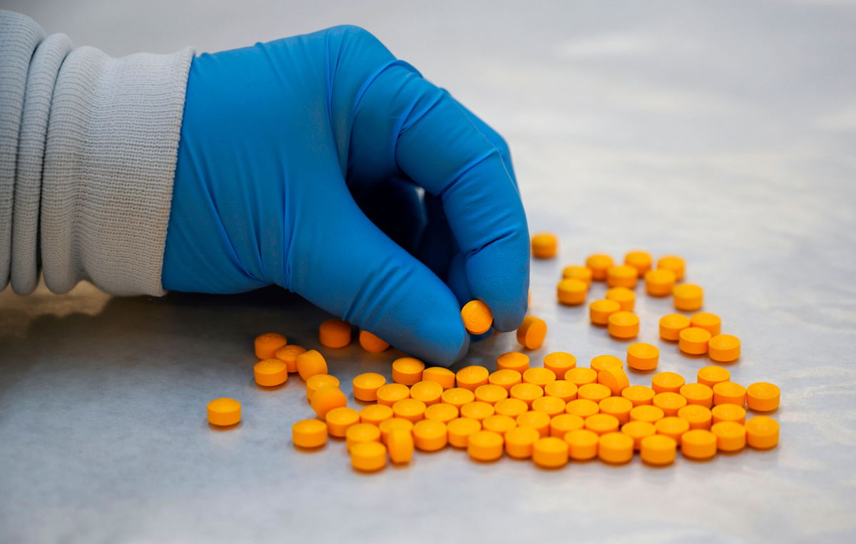 <i>Don Emmert/AFP/Getty Images</i><br/>A Drug Enforcement Administration (DEA) chemist checks confiscated powder containing fentanyl at the DEA Northeast Regional Laboratory on October 8