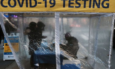 A Covid-19 testing site stands on a sidewalk in Midtown Manhattan on December 09