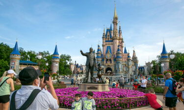 People visit Magic Kingdom Park at Walt Disney World Resort in Lake Buena Vista