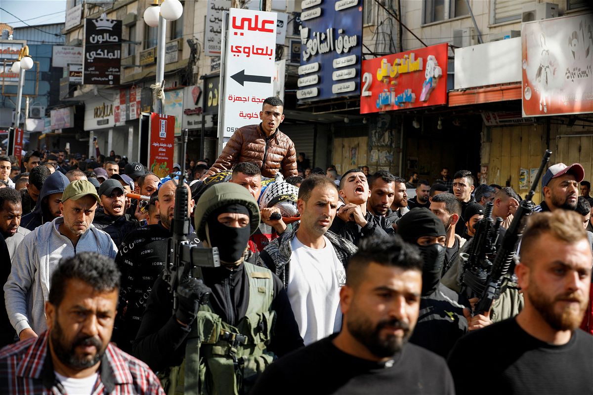 <i>Raneen Sawafta/Reuters</i><br/>Mourners take part in the funeral of Palestinians who were killed in an Israeli raid in Jenin