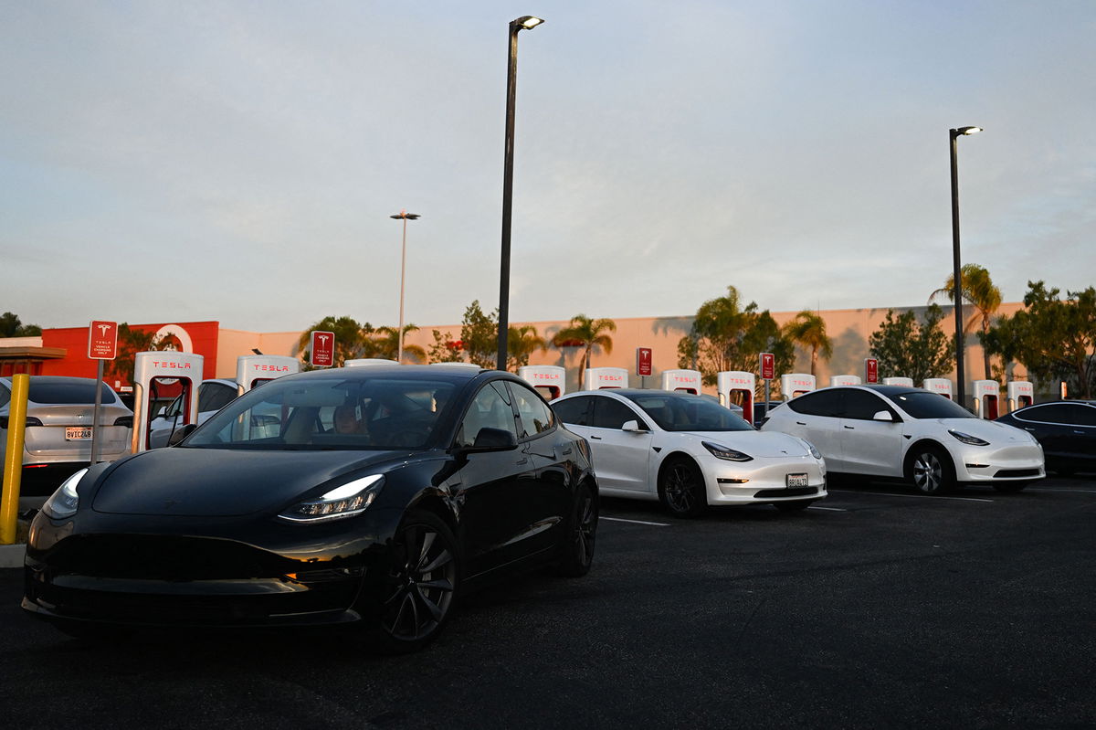 <i>Patrick T. Fallon/AFP/Getty Images</i><br/>A Tesla electric vehicle departs after charging at a supercharger location in Hawthorne