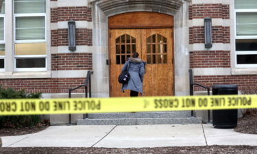 People retrieve belongings from Berkey Hall