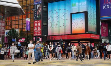 Officials expect Hong Kong's economy to grow between 3.5% and 5.5% this year. People here walk on a street in Causeway Bay on January 2