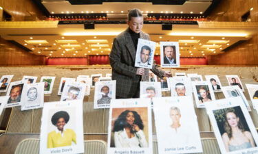 A staff member plots out nominee seating assignments ahead of the EE British Academy Film Awards