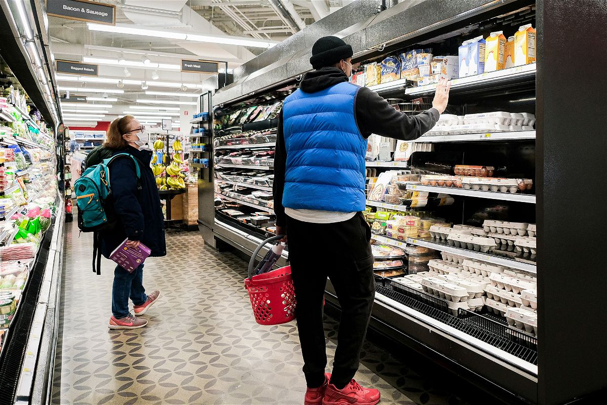 Consumers feel better about the economy this month.  Customers shop at a store in Queens.