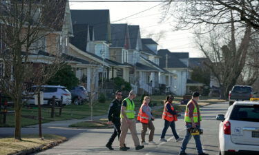 A group monitoring indoor air quality leaves a home in East Palestine