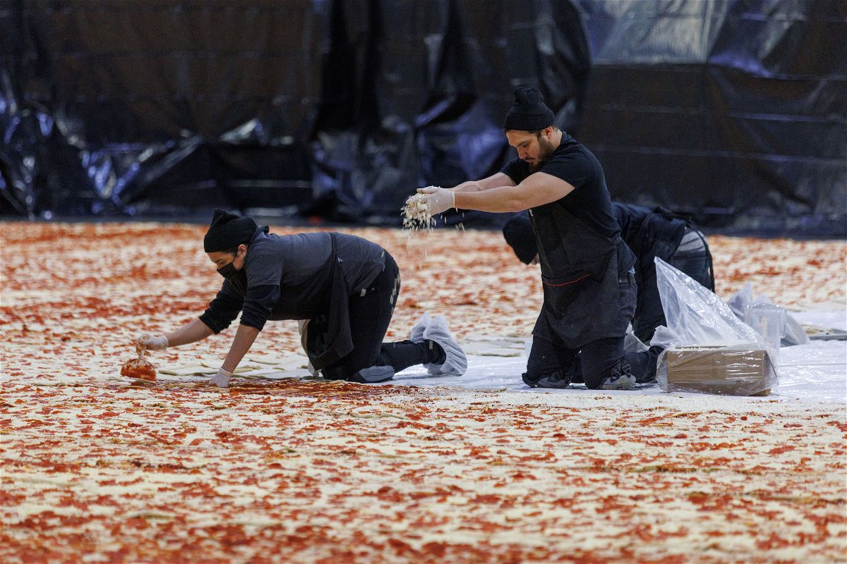 <i>Mike Blake/Reuters</i><br/>Cooks work inside the Los Angeles Convention Center on January 18