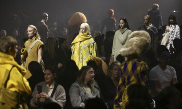 Models present creations at the Burberry catwalk show during London Fashion Week Monday