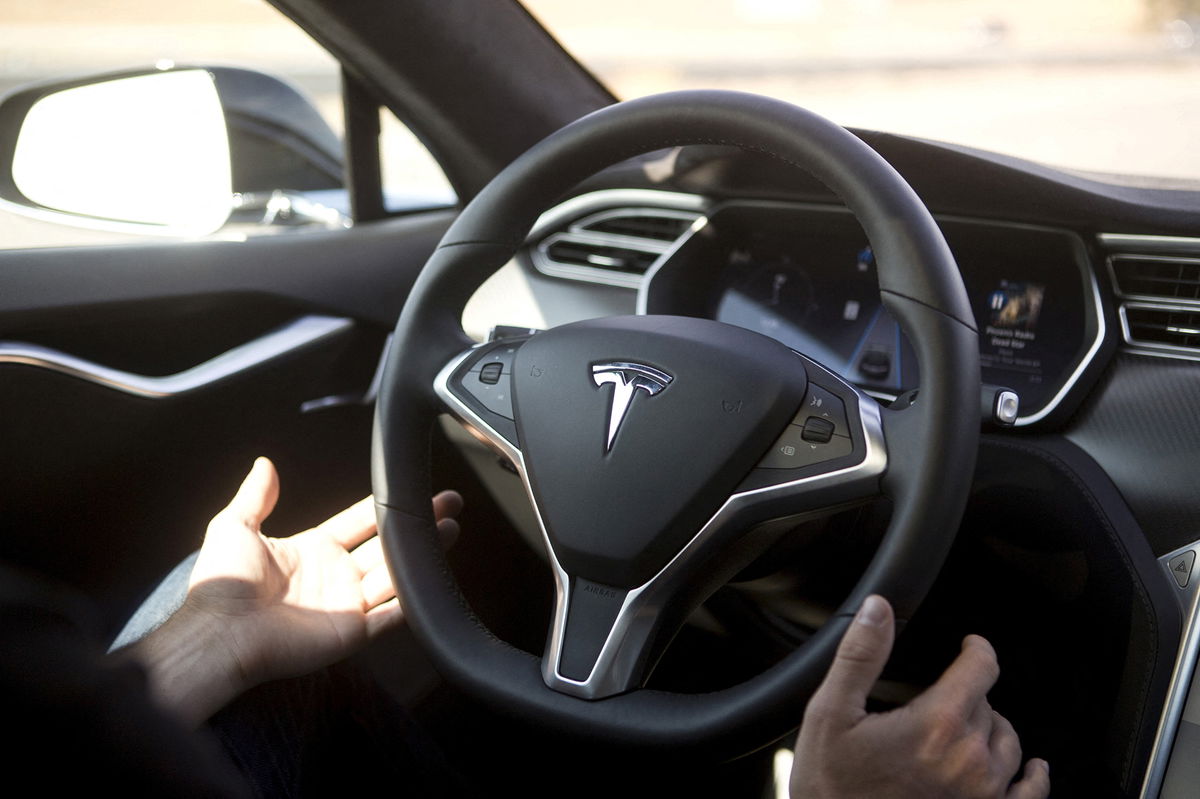 FILE PHOTO: New Autopilot features are demonstrated in a Tesla Model S during a Tesla event in Palo Alto, California October 14, 2015. REUTERS/Beck Diefenbach/File Photo