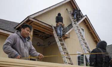 Home builder confidence jumped in February. Construction workers in Foley