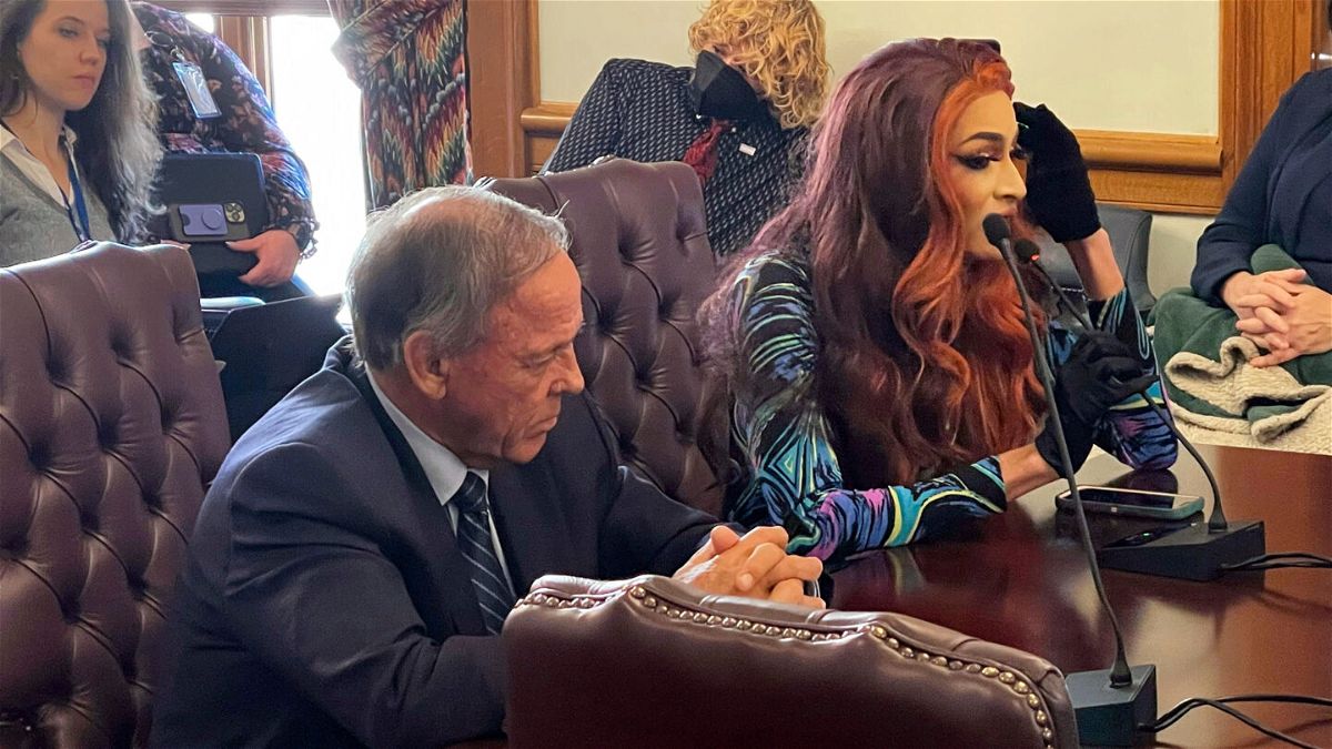 Drag performer MD Hunter, whose stage name is Athena Sinclair, testifies before a state Senate panel as state Sen. Gary Stubblefield, left, listens, at the Arkansas Capitol in Little Rock, Arkansas, on January 19.