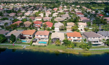 US home prices fell for the sixth month in a row in December. Pictured is a residential neighborhood on October 27