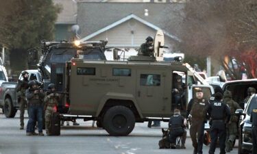 Law enforcement officers are seen here during a standoff with the kidnapping suspect in Grants Pass