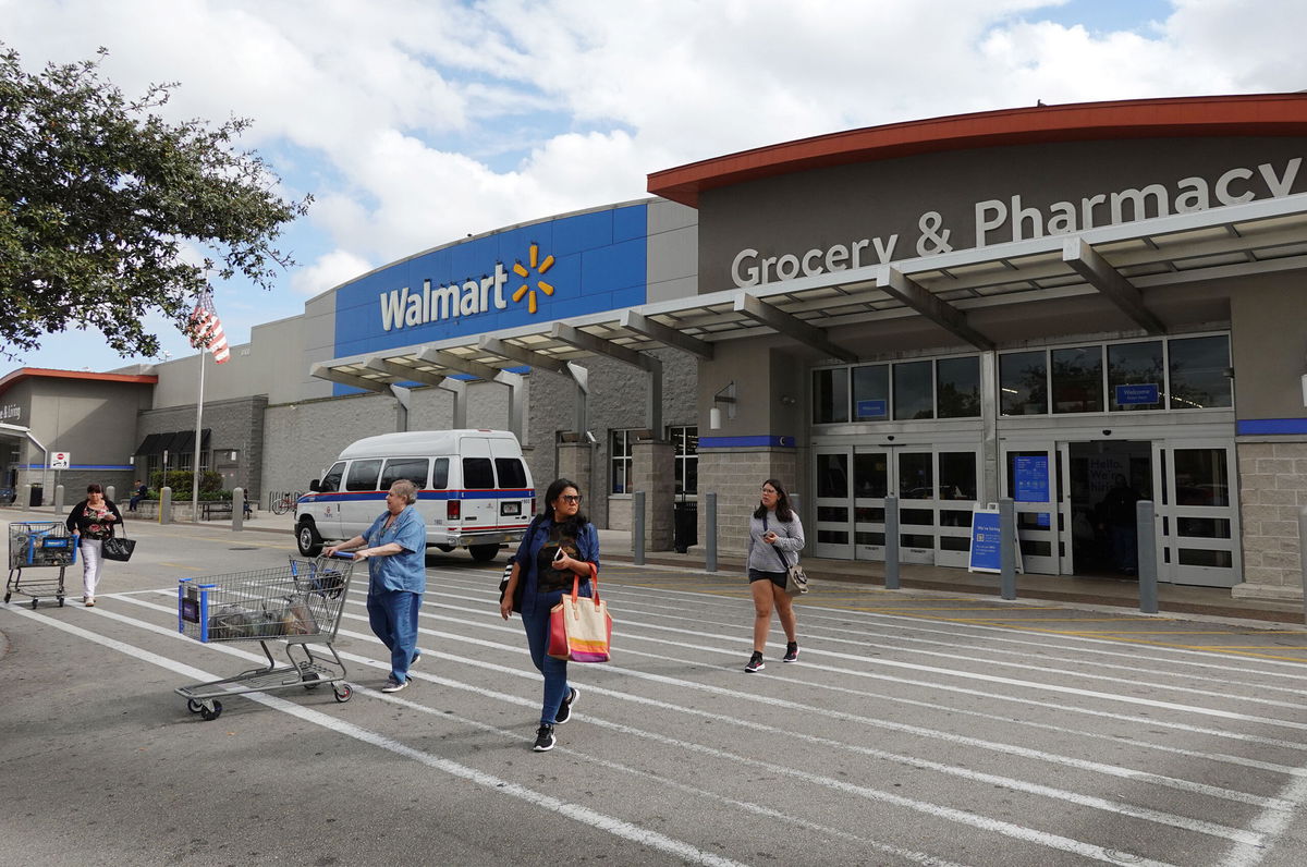 <i>Joe Raedle/Getty Images/File</i><br/>Customers exit a Walmart store on January 24