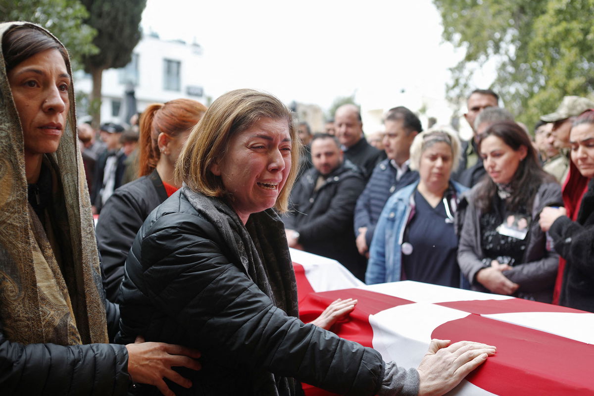 <i>Birol Bebek/AFP/Getty Images</i><br/>Mourners attend the funeral in Famagusta