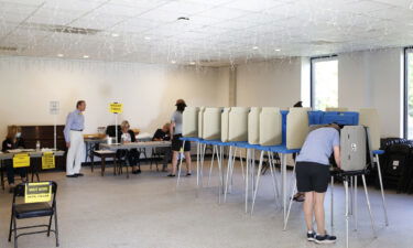 Voters are seen here at booths at Our Savior Lutheran Church in Raleigh