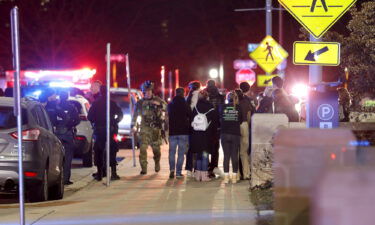 Students gather on the campus of Michigan State University after a shelter in place order was lifted early Tuesday.