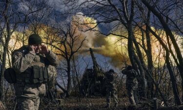 Ukrainian soldiers fire a self-propelled howitzer towards Russian positions near Bakhmut