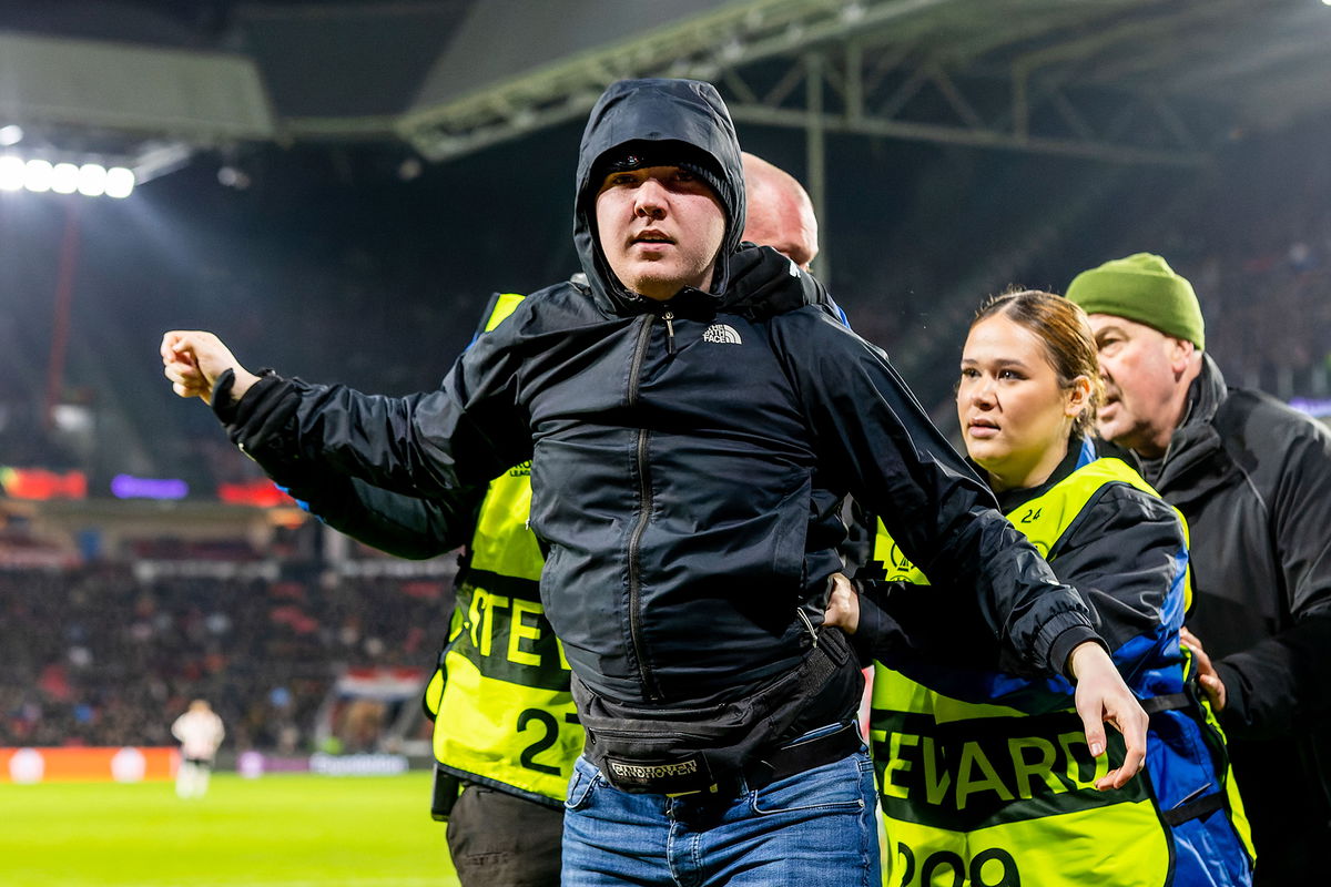 <i>ProShots/Icon Sport/Getty Images</i><br/>The fan was escorted from the pitch by security.