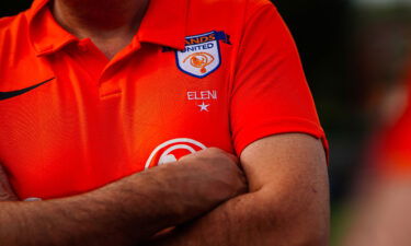 A Sands United FC London badge on a player's jersey.