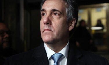 Former Donald Trump lawyer Michael Cohen walks out of a Manhattan courthouse after testifying before a grand jury on March 13