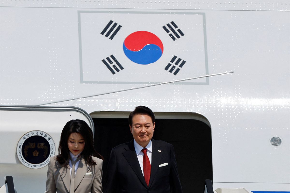 <i>Issei Kato/Reuters</i><br/>South Korea's President Yoon Suk Yeol and his wife Kim Keon-hee arrive at Tokyo International Airport in Tokyo