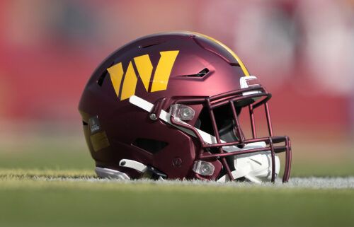 A detailed view of a helmet belonging to a Washington Commander player is seen on the field during pregame warm ups on December 24