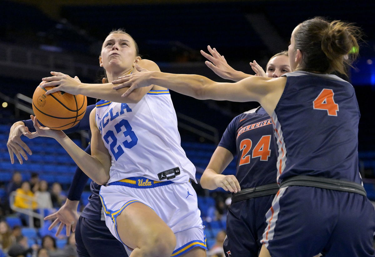 <i>Jayne Kamin-Oncea/Getty Images</i><br/>Gabriela Jaquez is fouled by Aixchel Hernandez as she drives past Kathryn Neff and Gabi Vidmar of the CSU Fullerton Titans on December 10