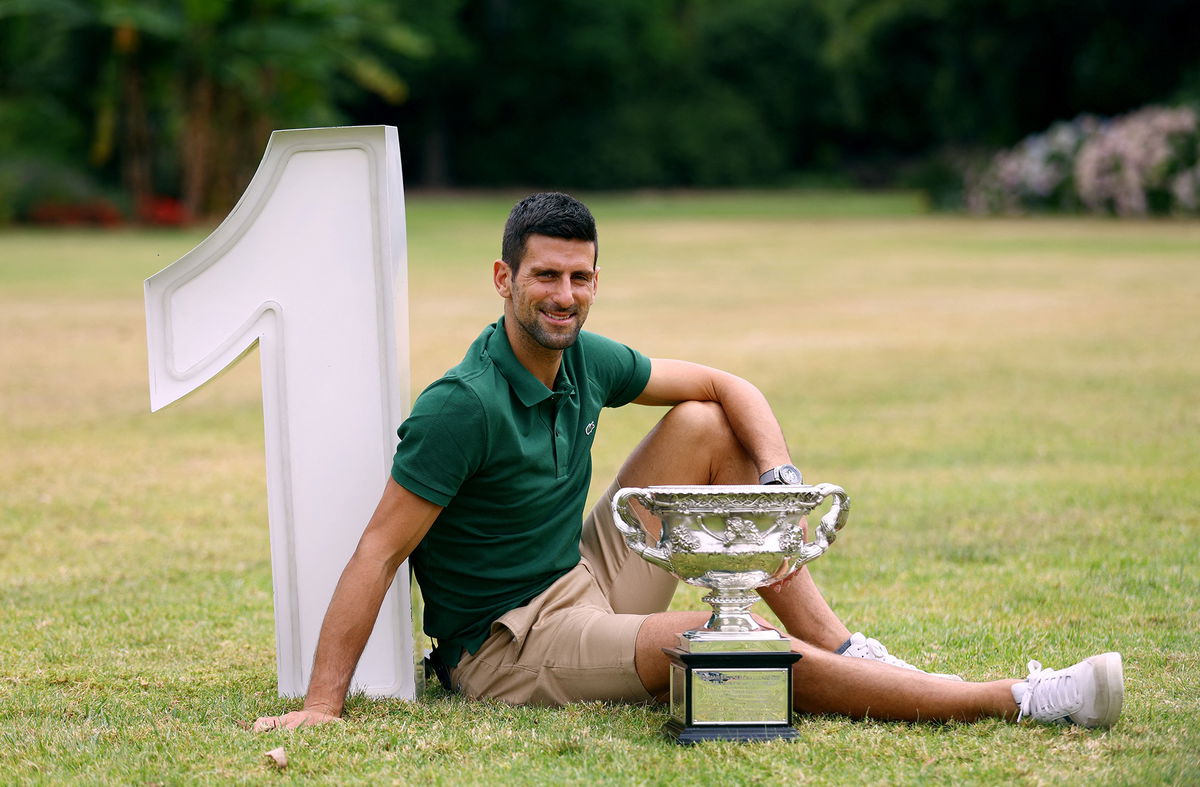 <i>Carl Recine/Reuters</i><br/>Australian Open champion Novak Djokovic poses with the trophy.